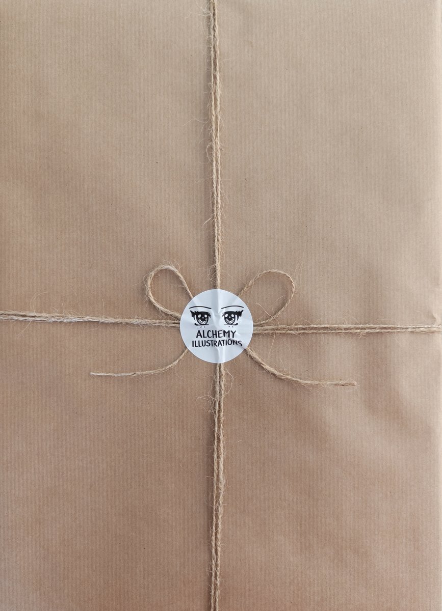 A finished illustration wrapped in kraft paper with twine and an Alchemy Illustrations sticker